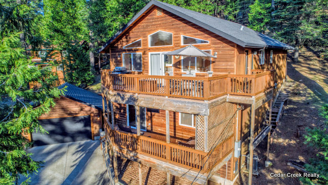 Retreat to the Treetops in a Beautiful Blue Lake Springs Home Offered by Cedar Creek Realty